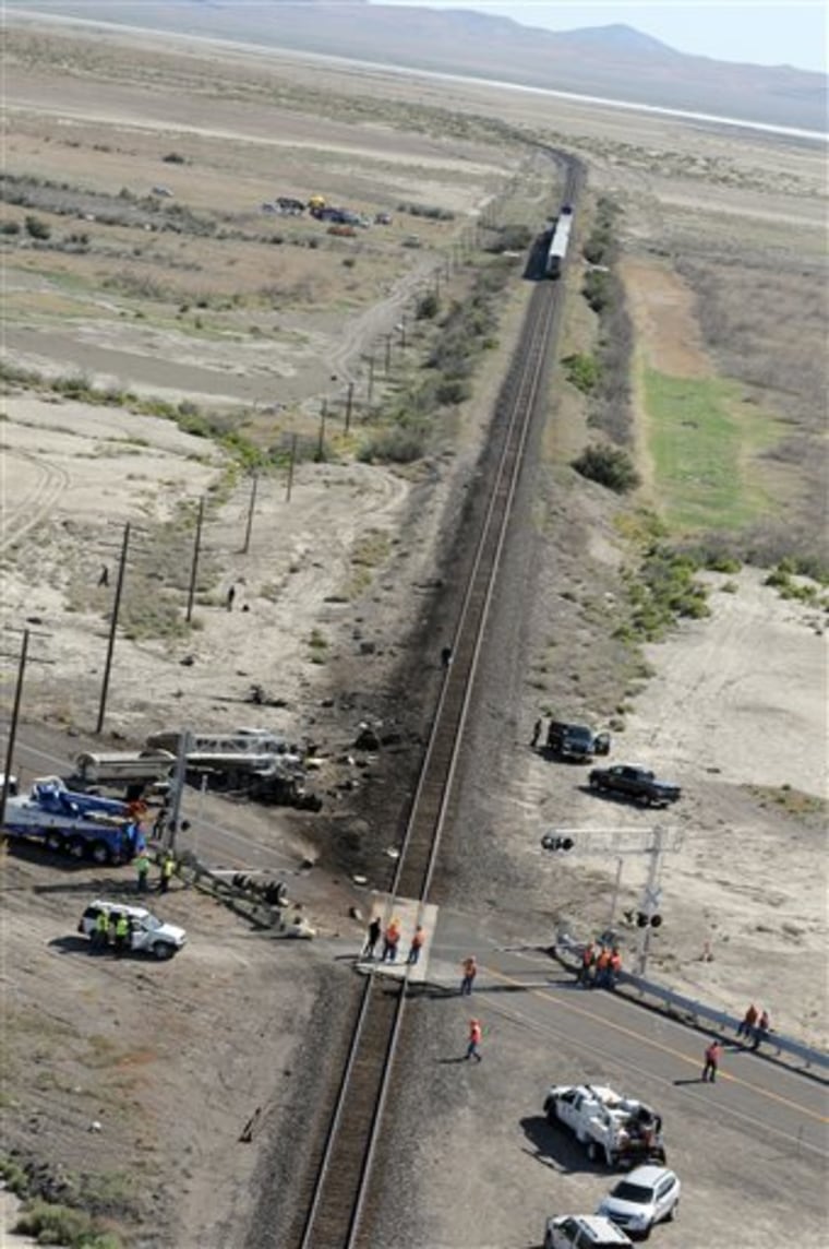 The wreckage of a truck is seen at right at the site of a collision between an Amtrak westbound train and a truck on U.S. 95 about 4 miles south of Interstate 80 on Friday, June 24, 2011, 70 miles east of Reno, Nev. The truck driver and one person on the train were killed said Nevada Highway Patrol Trooper Dan Lopez. An unknown number of other people on the train were injured and were being taken by ambulances to the hospital (AP Photo/The Reno Gazette-Journal, Marilyn Newton) NEVADA APPEAL OUT; NO SALES